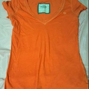 Abercrombie Fitch orange shirt.